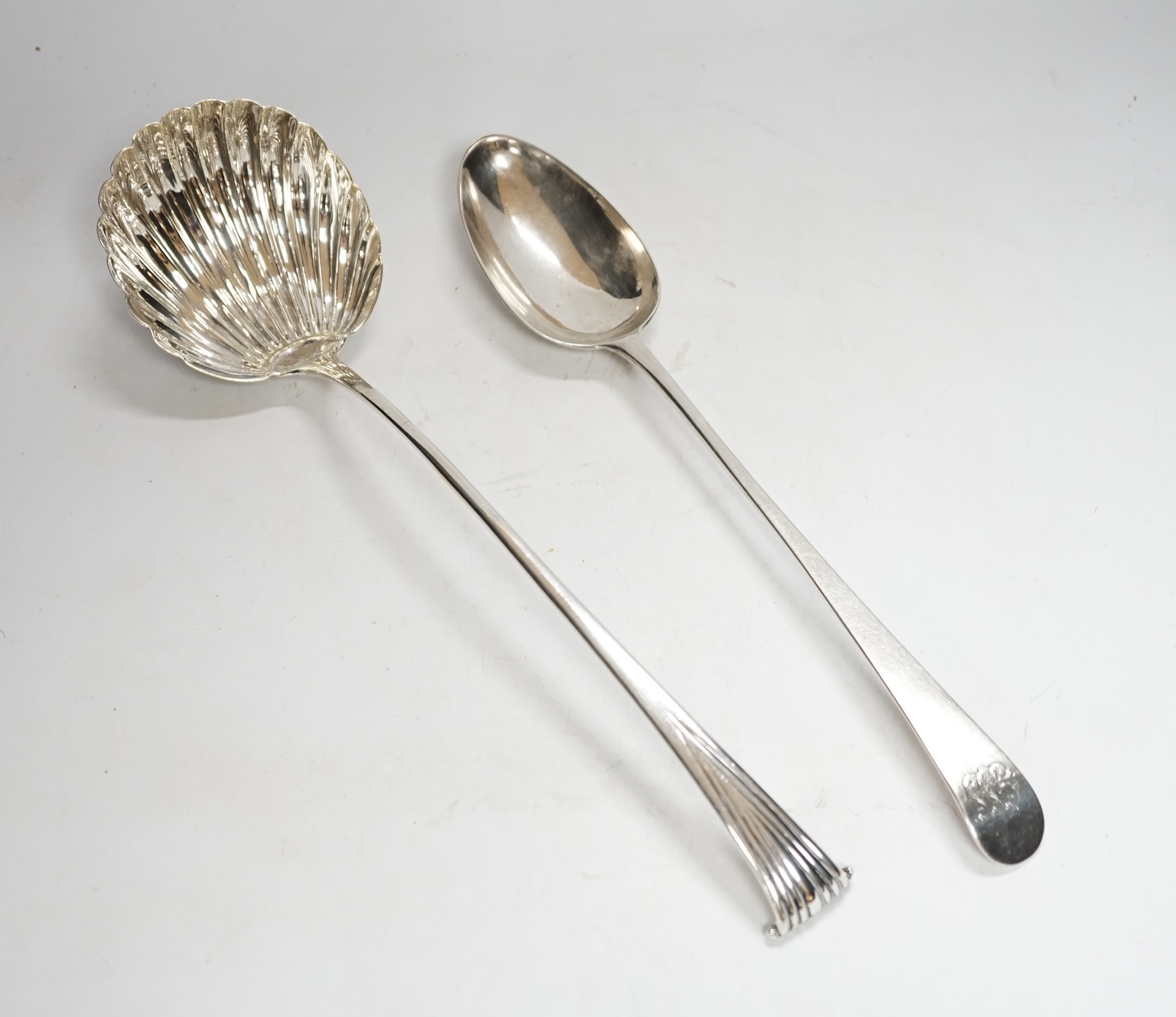 A George III silver Old English pattern basting spoon, Thomas Evans, London, 1785, 31.4cm, together with a white metal Onslow pattern soup ladle.